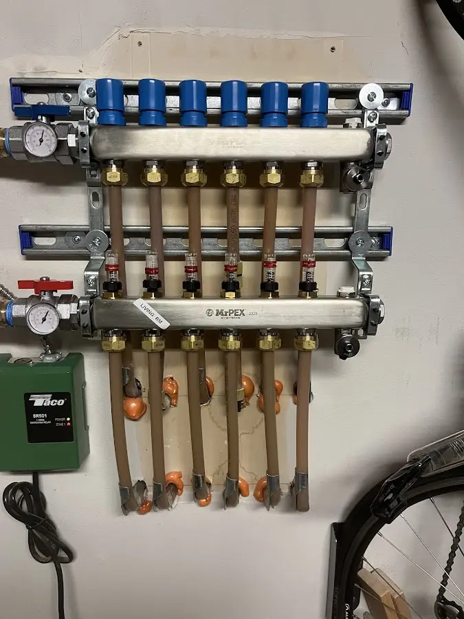 Plumber performing Water Heater Repair at a residential property in Germantown